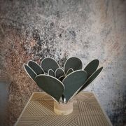 Flower table lamp made of rattan and fir green linen petals