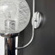 Chrome wall light with blown glass from the 1970s.