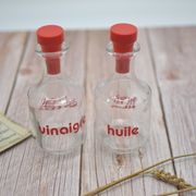 Oil and vinegar with red writing