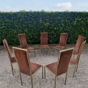 8 vintage 1970s chairs in brass and velvet with high backs.