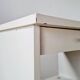 Vintage bedside table with tapered legs - white