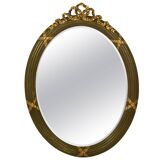 Faceted wall mirror in neoclassical Gustavian style, oval, in gilded wood, Italy, 1900s.