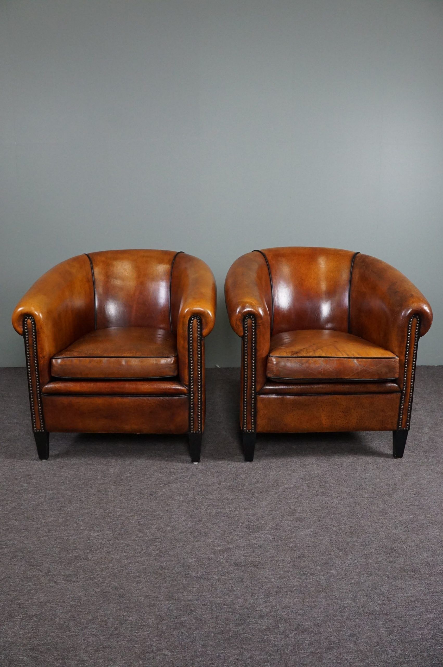 Set of 2 club chairs in black piping sheep leather