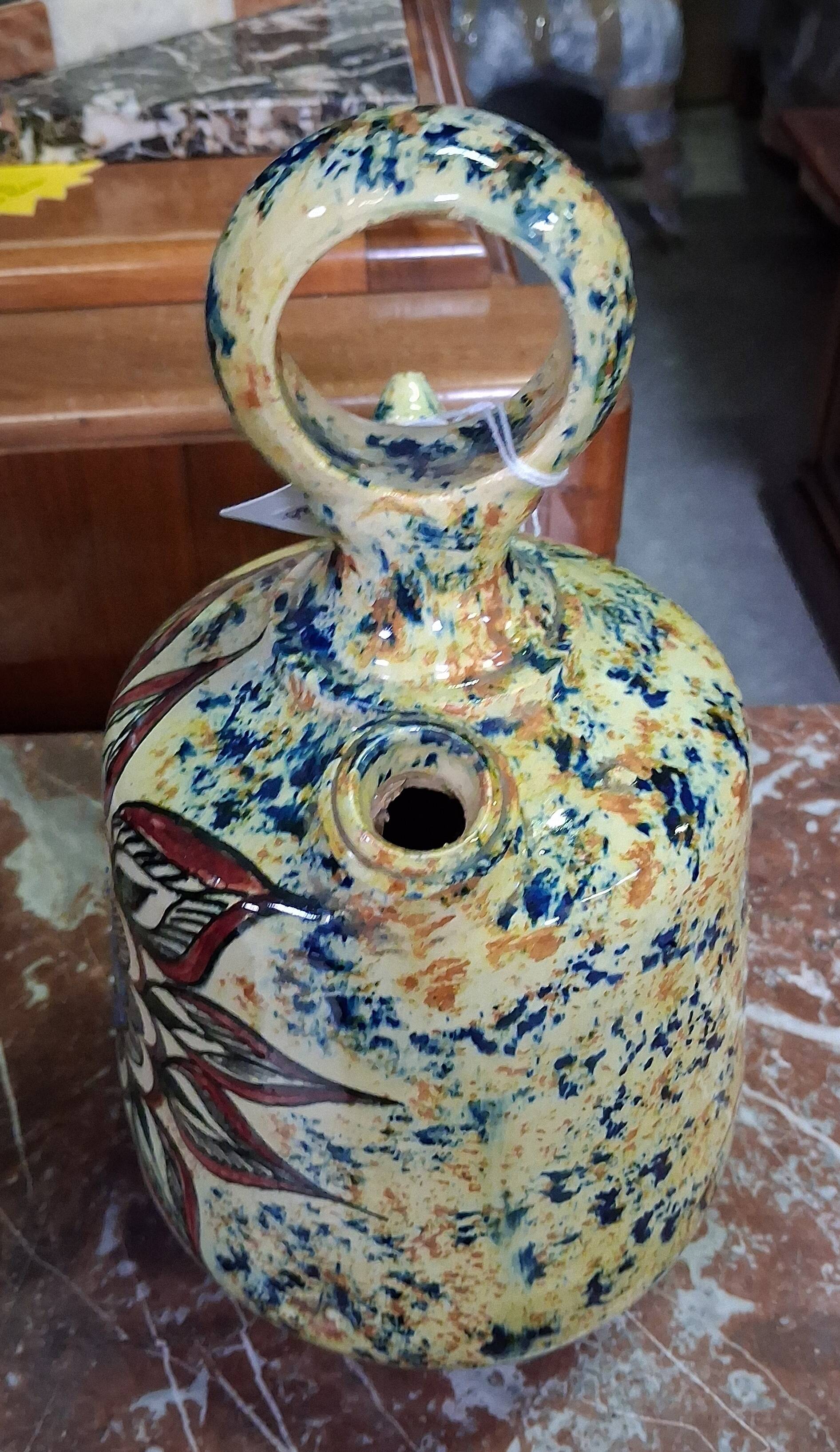 polychrome floral-decorated jug in glazed ceramic