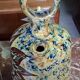 polychrome floral-decorated jug in glazed ceramic