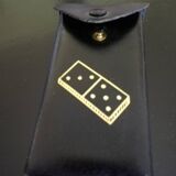 Complete set of miniature dominoes in black and white box.