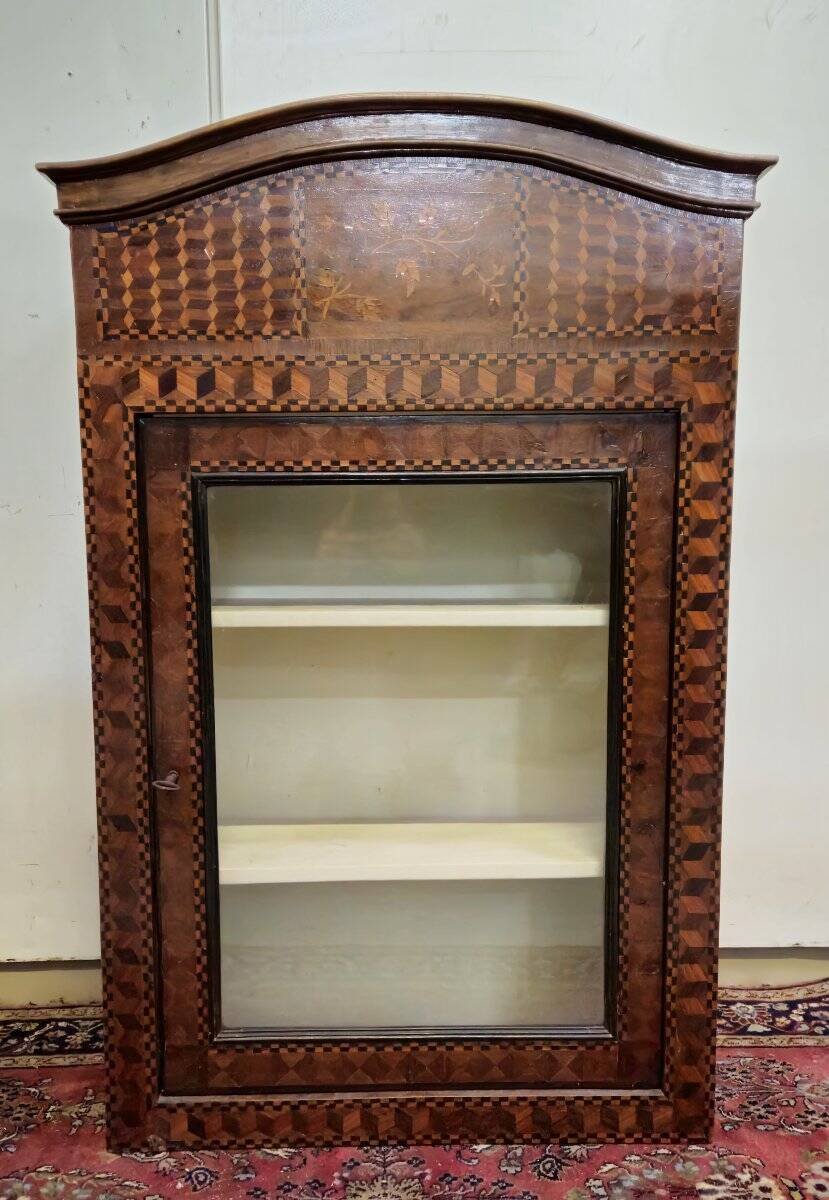 Antique Louis XV display cabinet with geometric marquetry decoration.