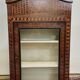 Antique Louis XV display cabinet with geometric marquetry decoration.
