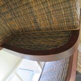 2 colonial-style armchairs in woven rattan and exotic wood