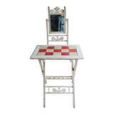 Small antique folding wooden dressing table with tiles and a mercury mirror.