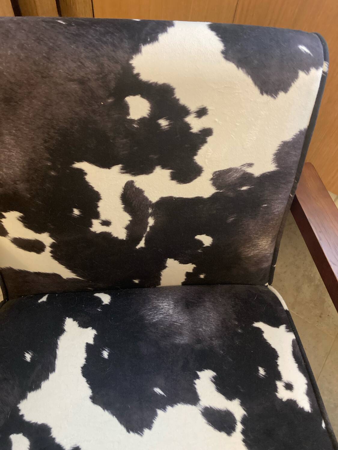 Armchair in walnut and animal print velvet