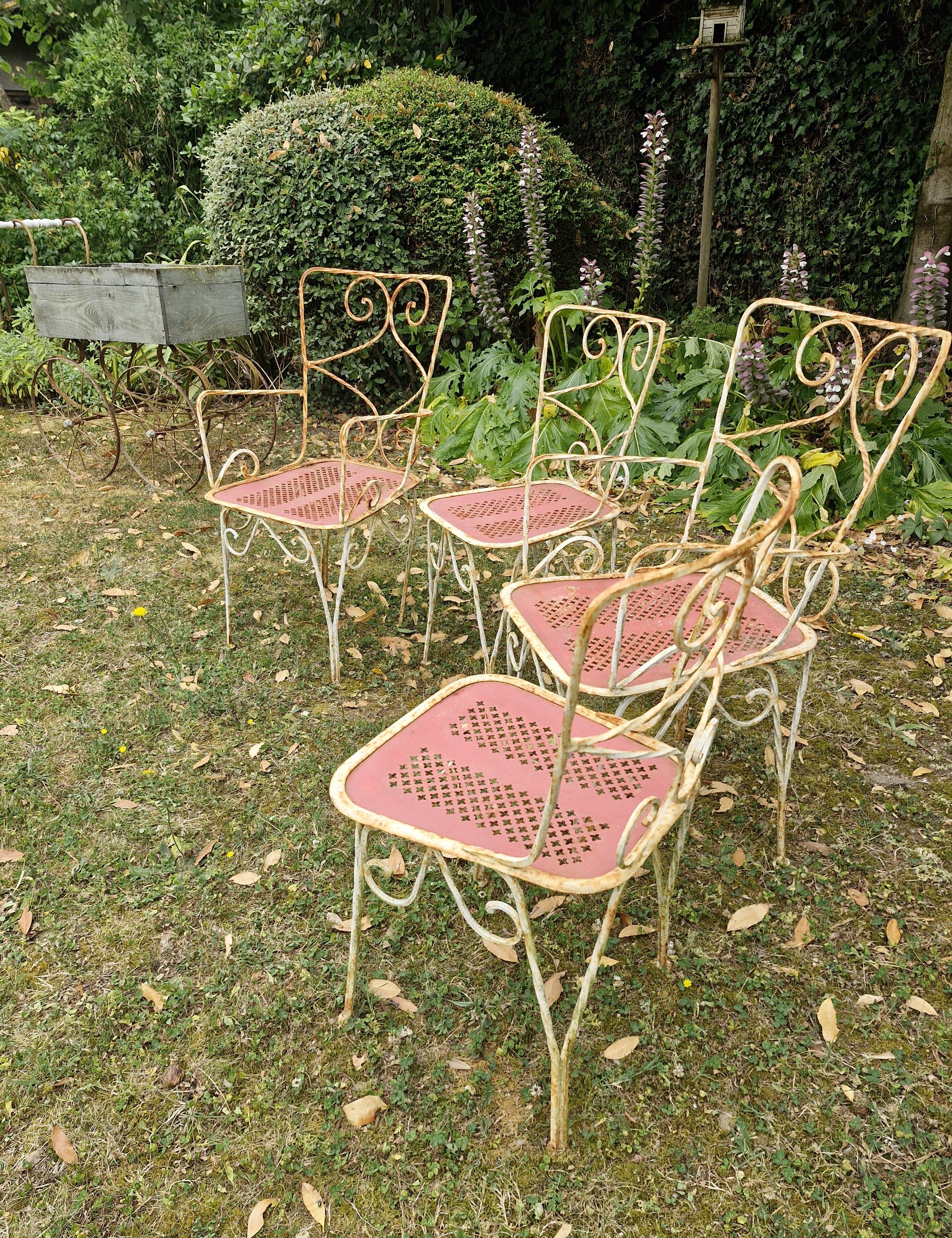 Perforated metal garden chairs and armchairs
