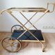 Vintage golden metal dessert on wheels