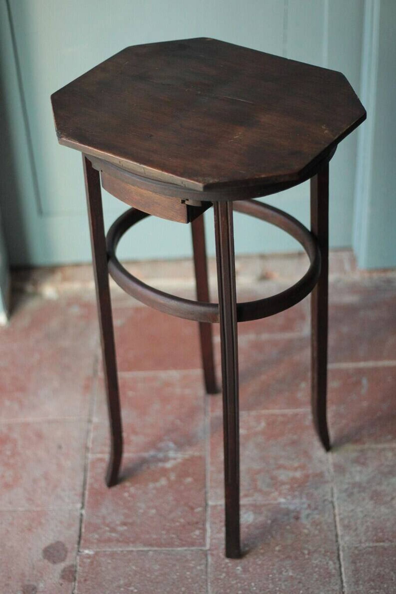 Wooden drawer table or 19th-century work table with a curved wooden stretcher, in the style of Thonet, circa 1900-1920.