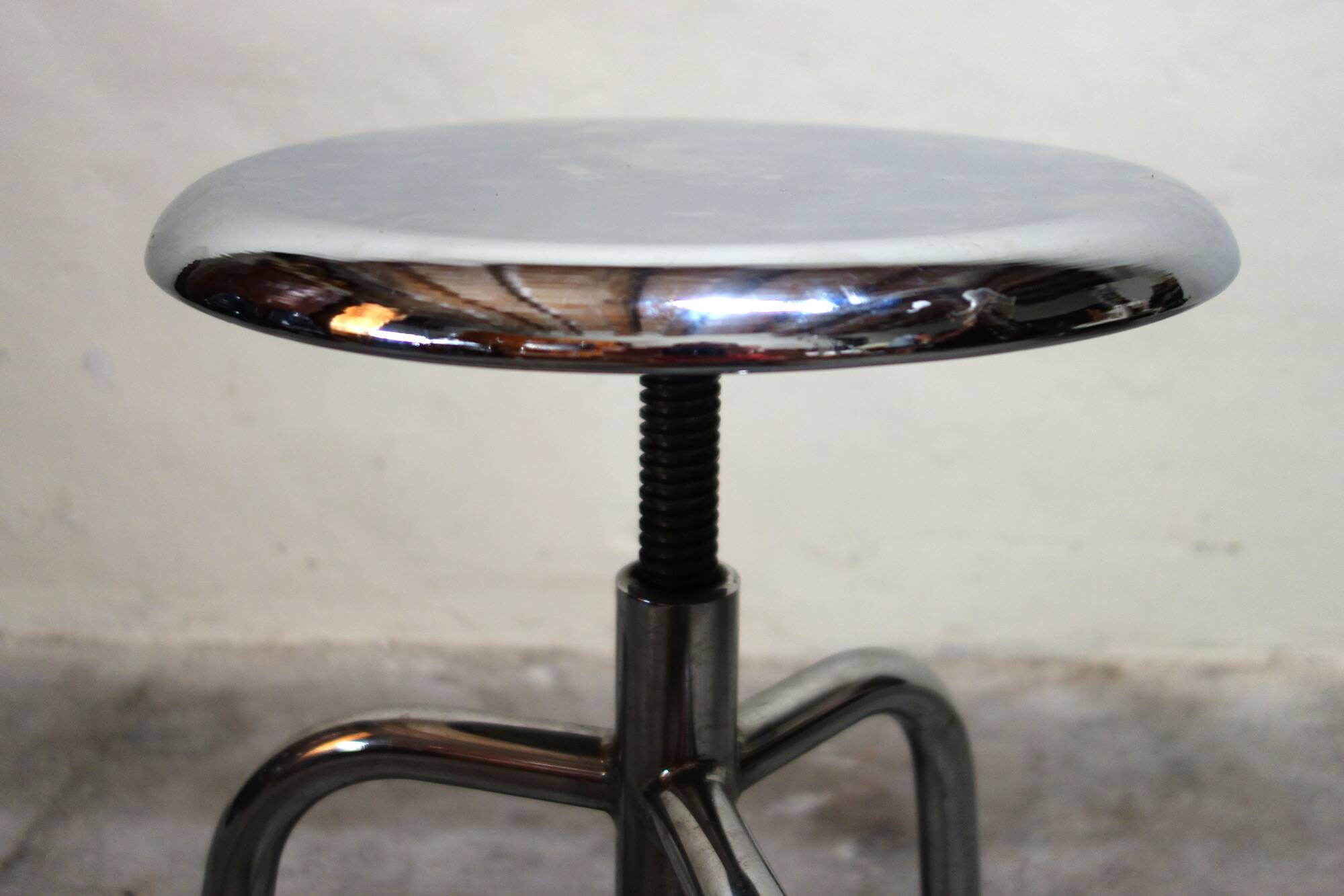 Old chrome metal swivel medical stool