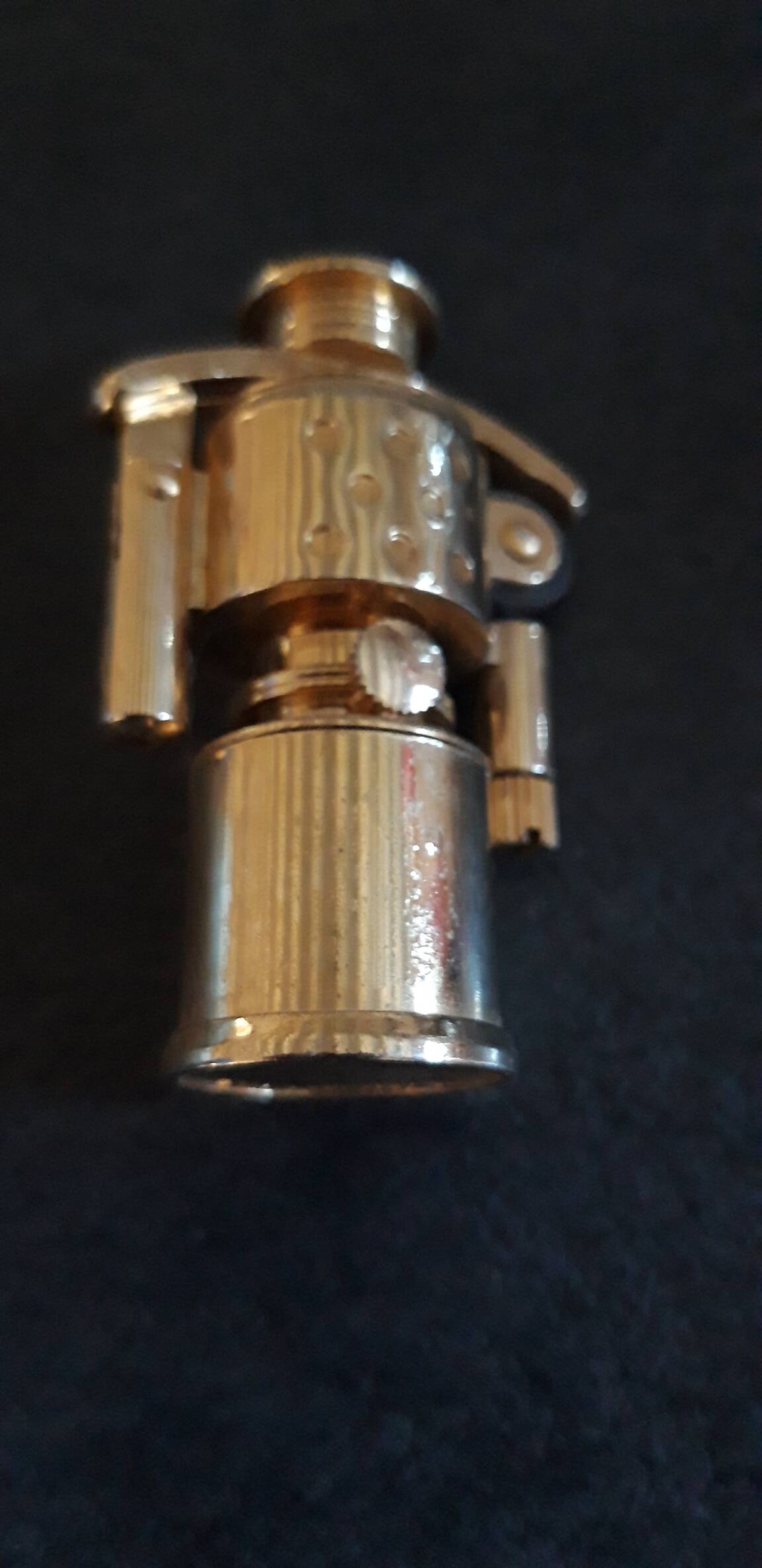 Old small golden storm gasoline lighter