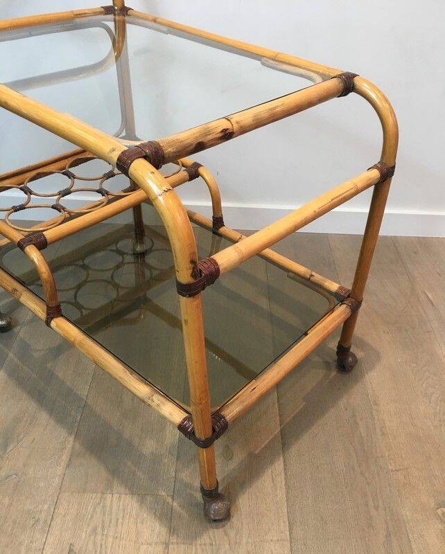 Rolling table made of rattan and leather straps