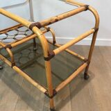 Rolling table made of rattan and leather straps
