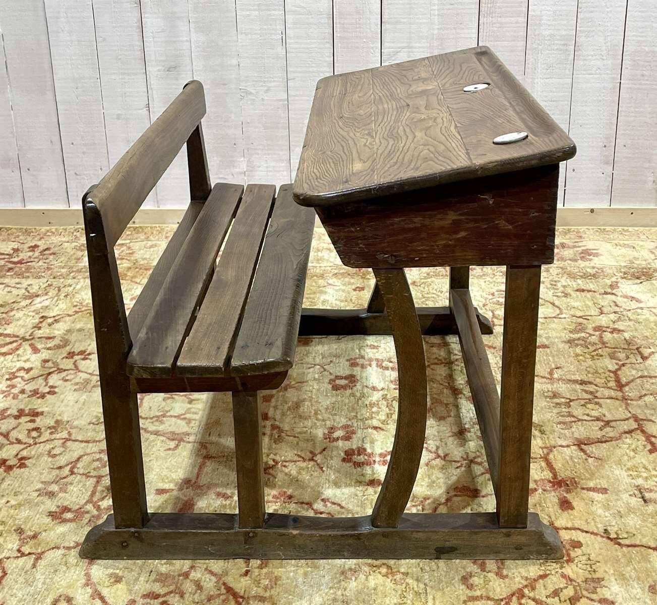 Early 20th-century oak school desk with porcelain inkwells
