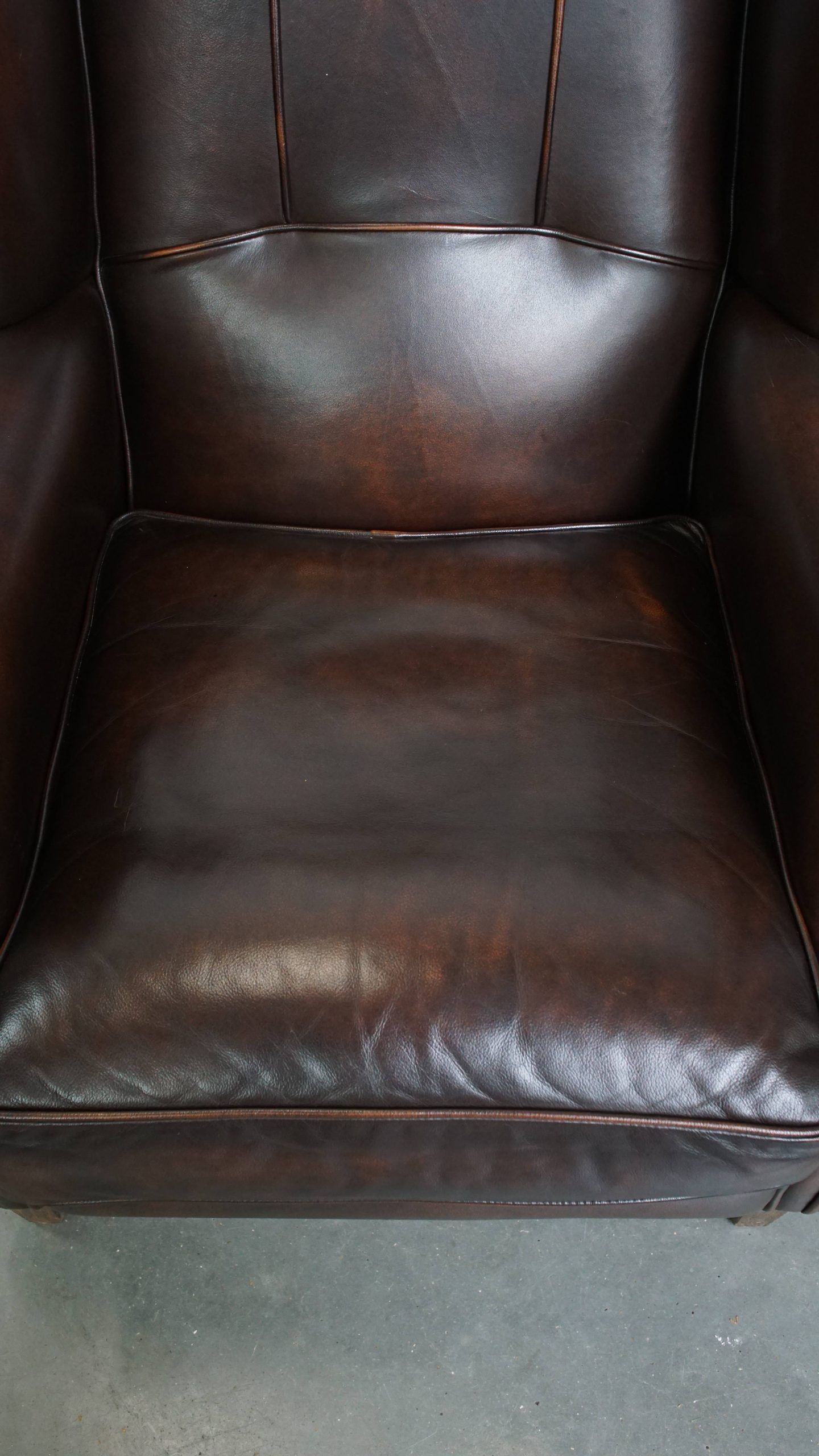 Comfortable and very beautiful set of 2 cow leather wingback armchairs in English style