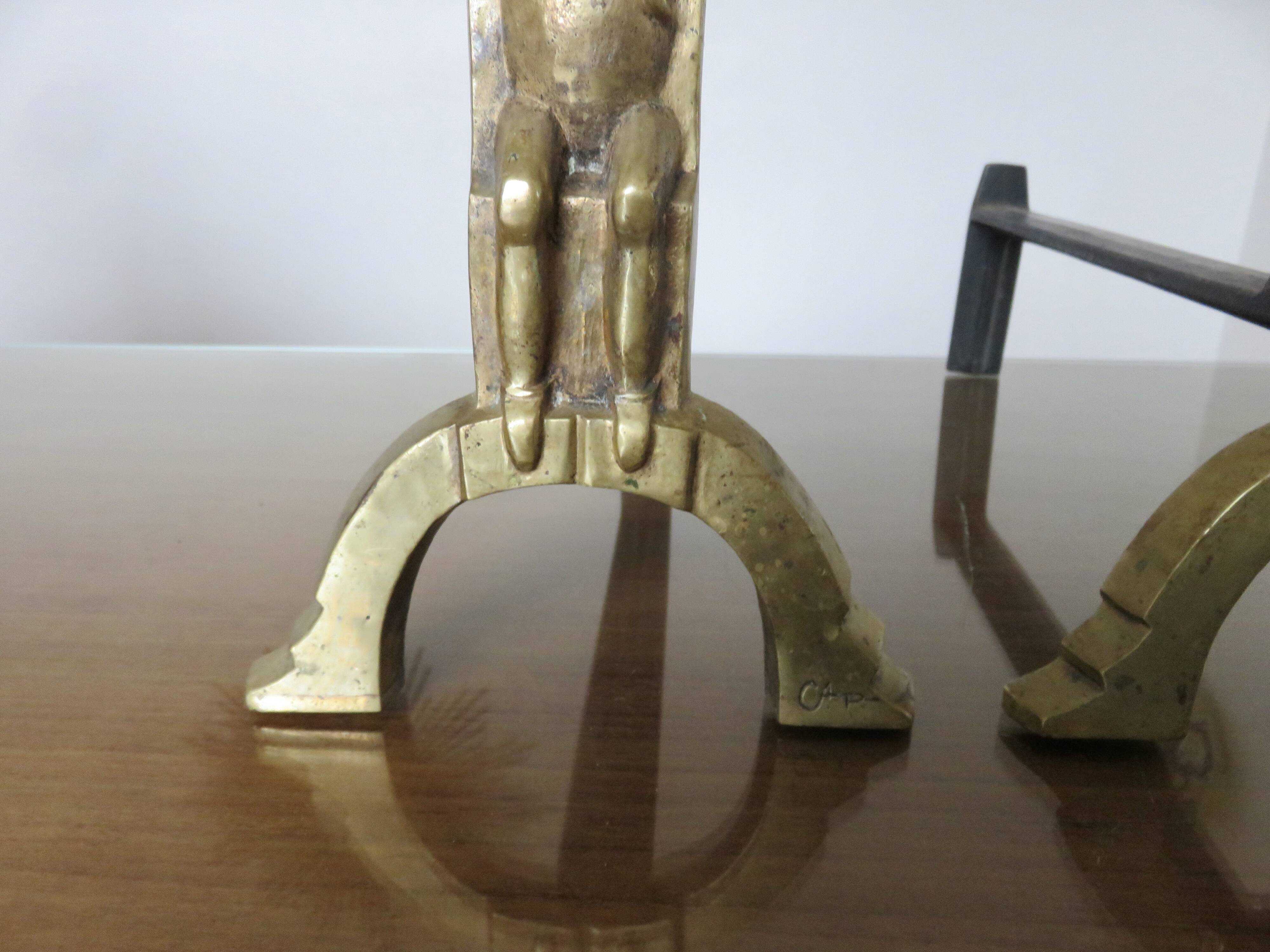 Anton Prinner, pair of Shaman fire dogs in gilded bronze, monogrammed, 1930