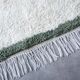 Handmade natural wool rug in green and white, 150x250 cm.
