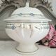Antique deep plates in ironstone with a soup tureen.