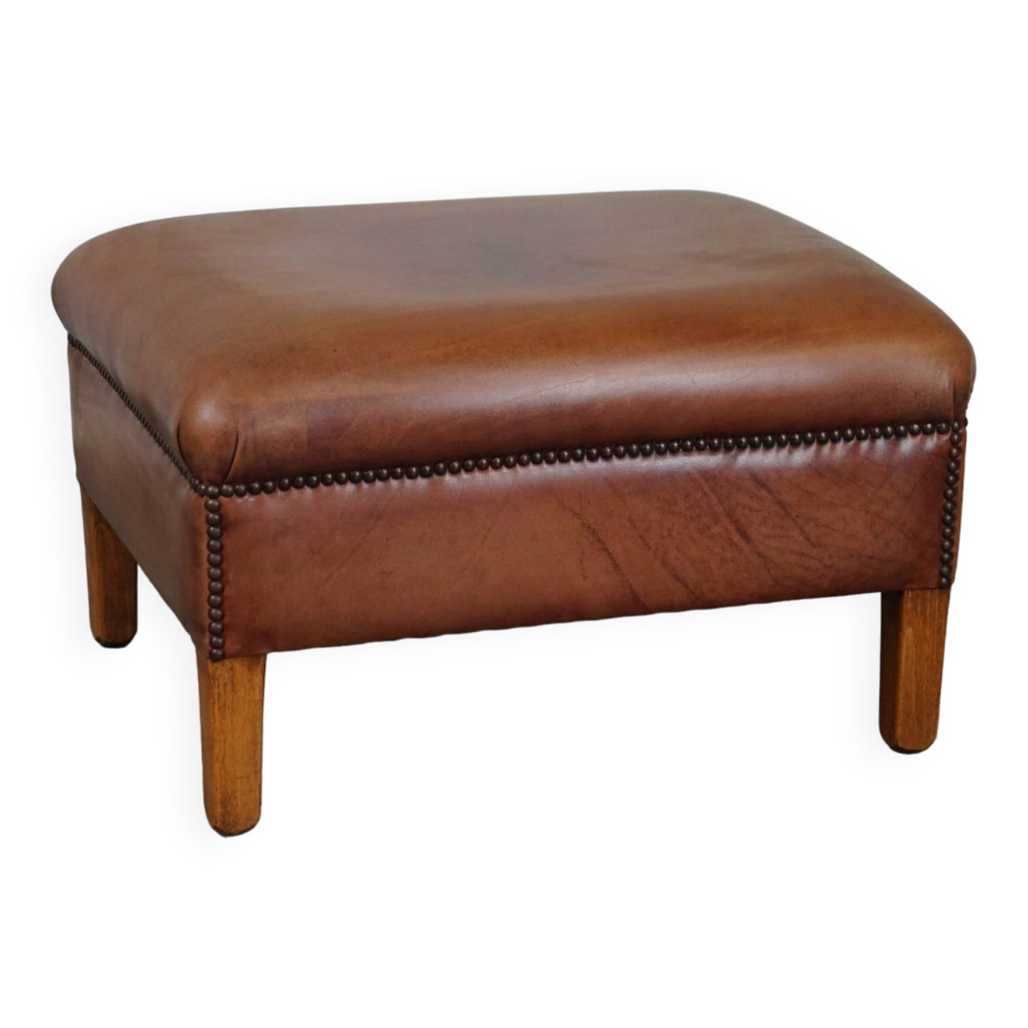 English-style leather ottoman in cognac-colored leather
