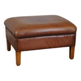English-style leather ottoman in cognac-colored leather