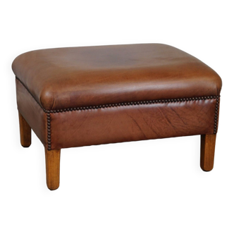 English-style leather ottoman in cognac-colored leather