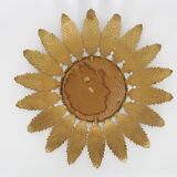 Old sun mirror with foliage in gilded metal with twisted frieze from the 60s