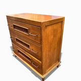 Vintage 1970s chest of drawers: wood and rattan, splayed legs.