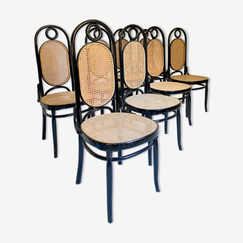 Huit chaises en bois courbé et cannage de Salvatore Leone