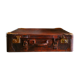 Old cardboard suitcase covered with patinated leather