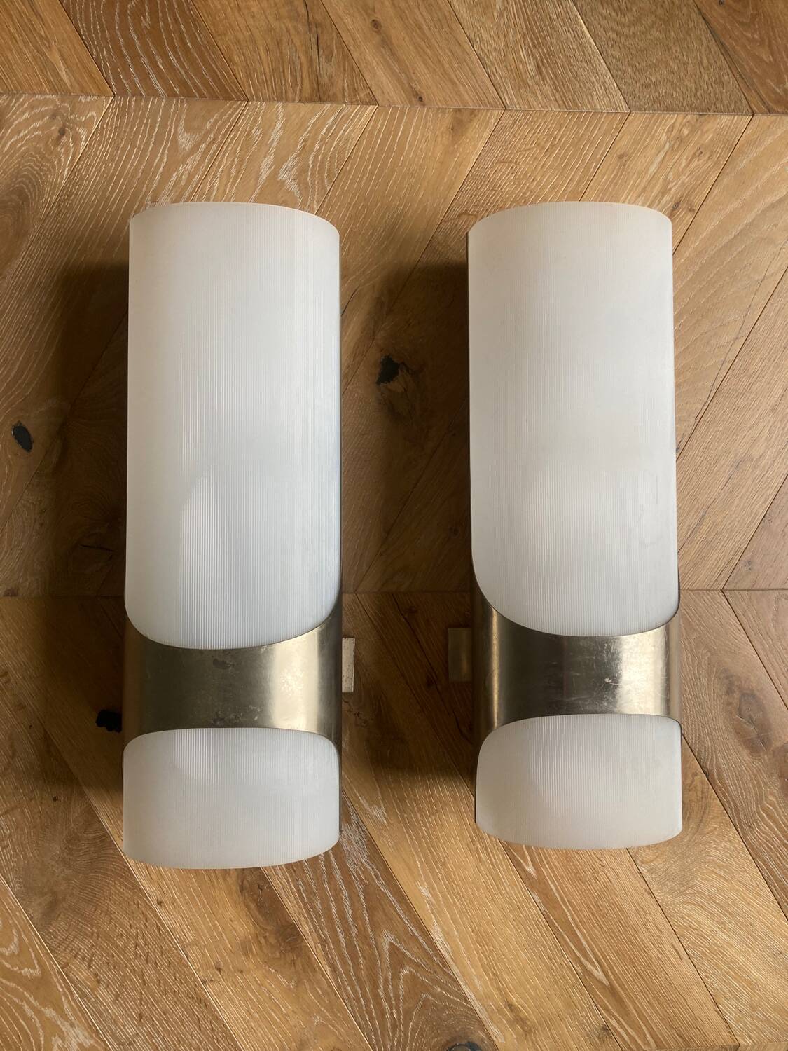 Brushed metal and ribbed opal plastic wall lights
