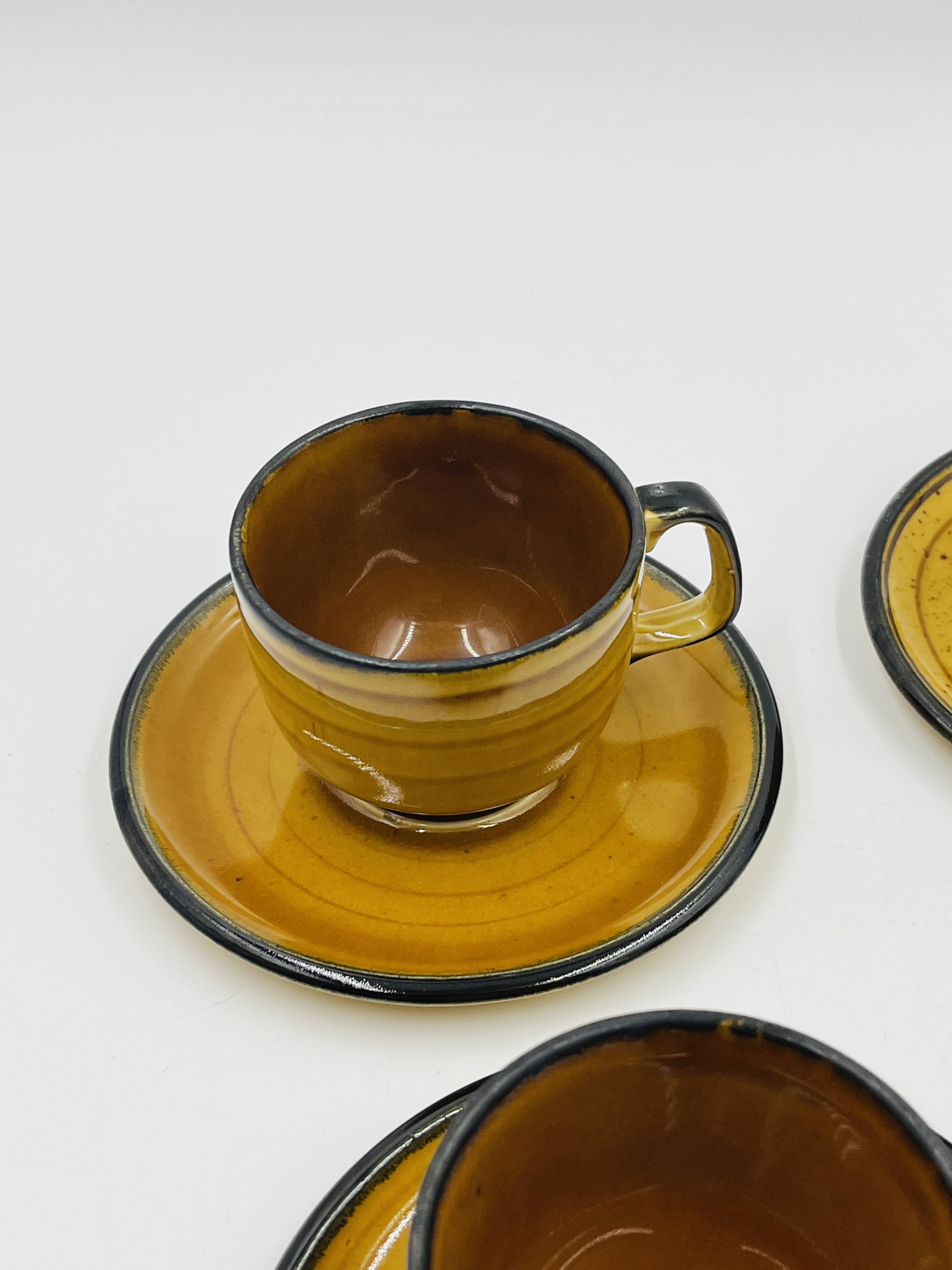 Set of four vintage Boch Palma cups and saucers.