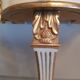 Console de style Louis XVI en bois laqué doré
