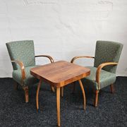 Halabala “Spider” coffee table and Hungarian late Art Deco armchairs, 1950s