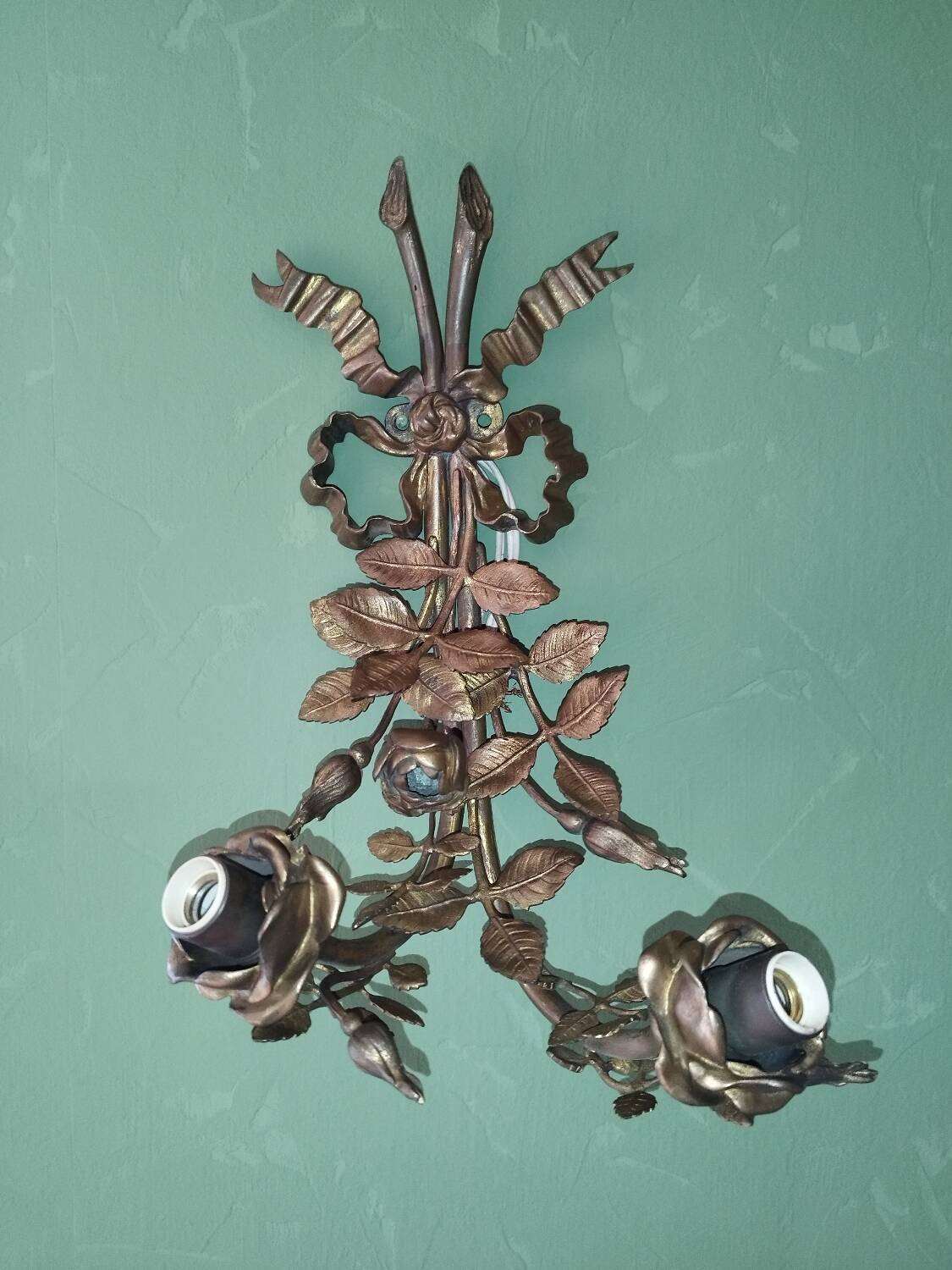 Pair of bronze and gilded metal wall sconces in the Louis XVI style.