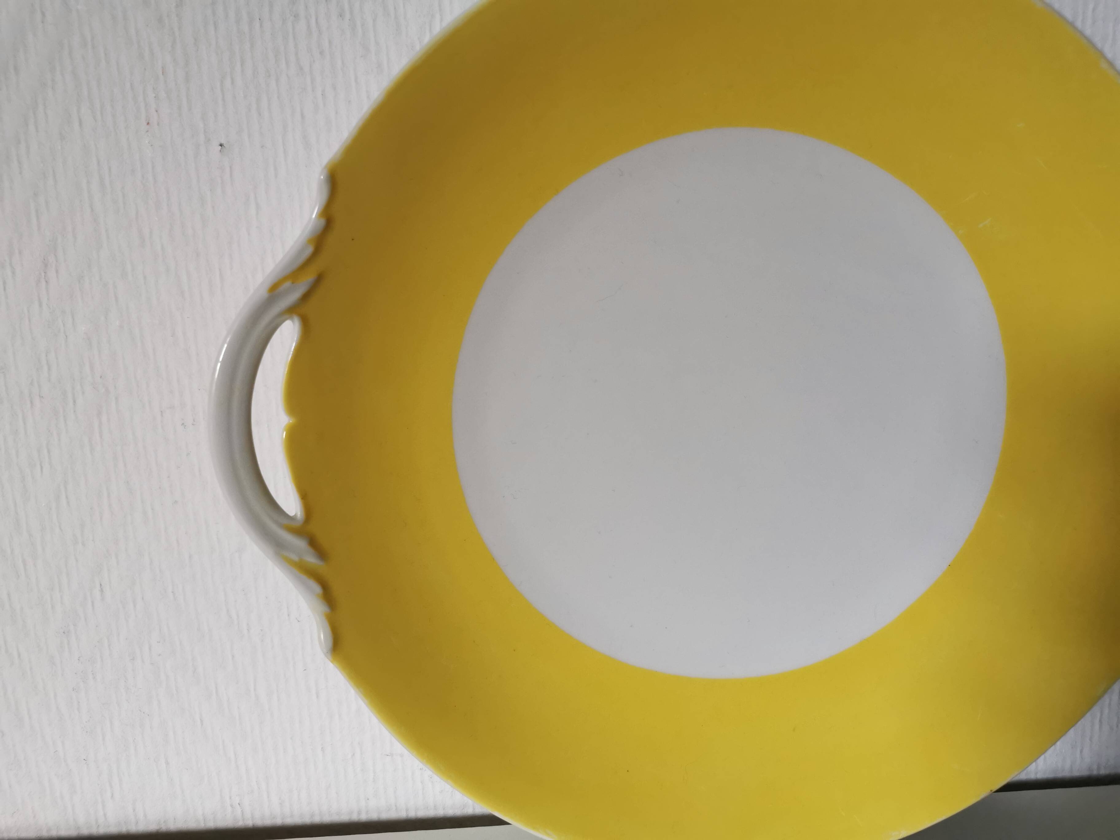 round yellow and white Limoges porcelain serving dish