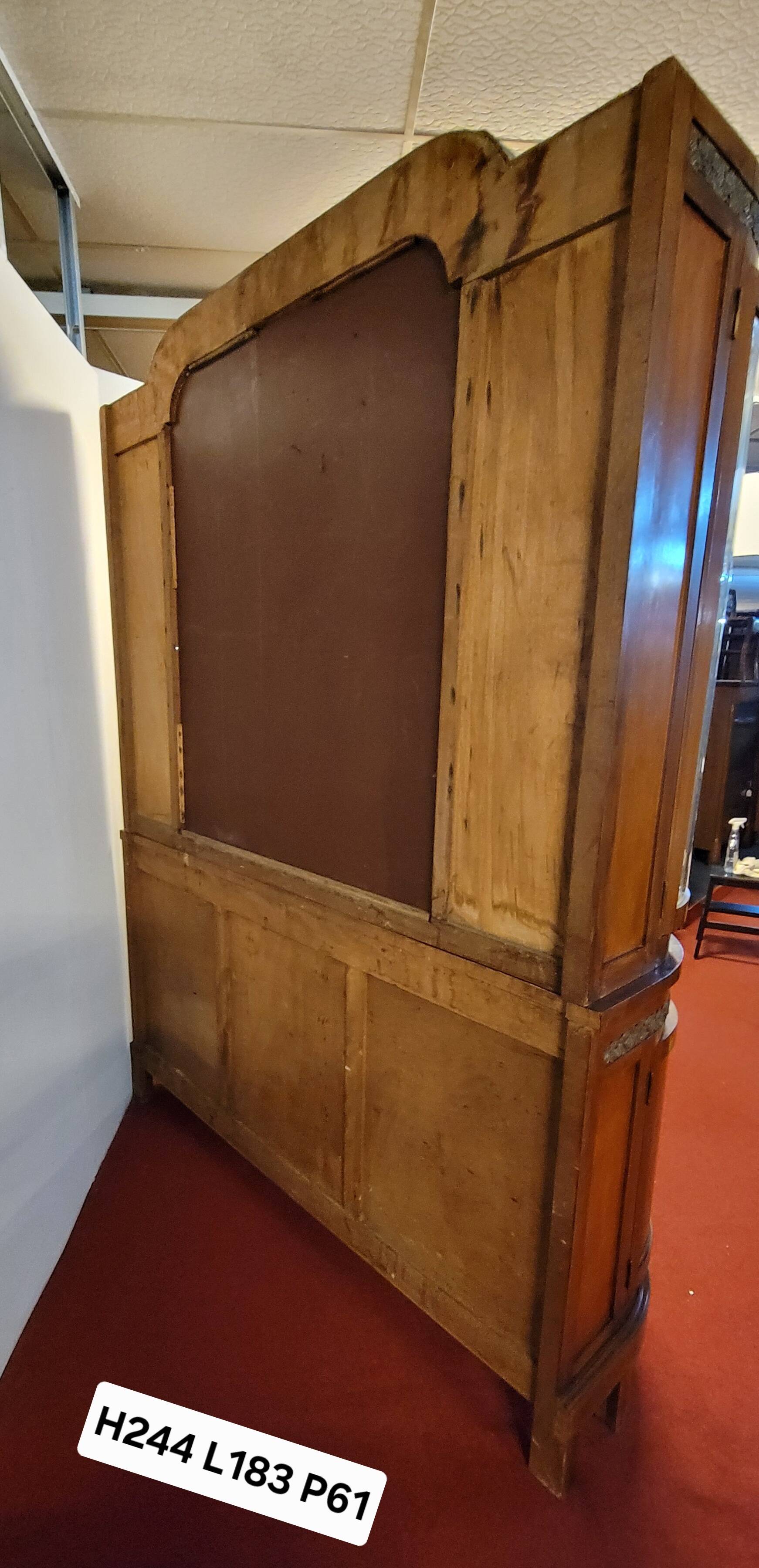 Empire style half-moon shaped mahogany bookcase with putti