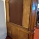 Empire style half-moon shaped mahogany bookcase with putti