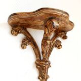 Golden wood wall console in Louis XV style.