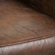 Comfortable sheepskin armchair with matching piping and a timeless look