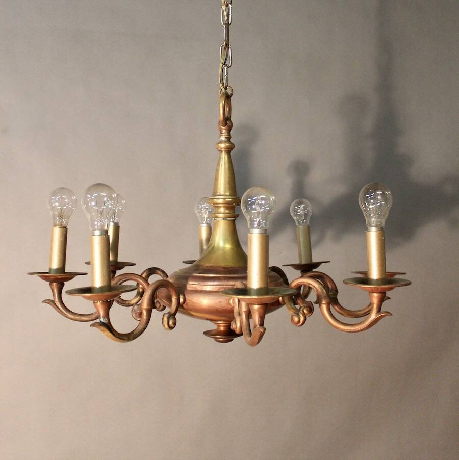 Bronze chandelier with double patina and 8 light arms.