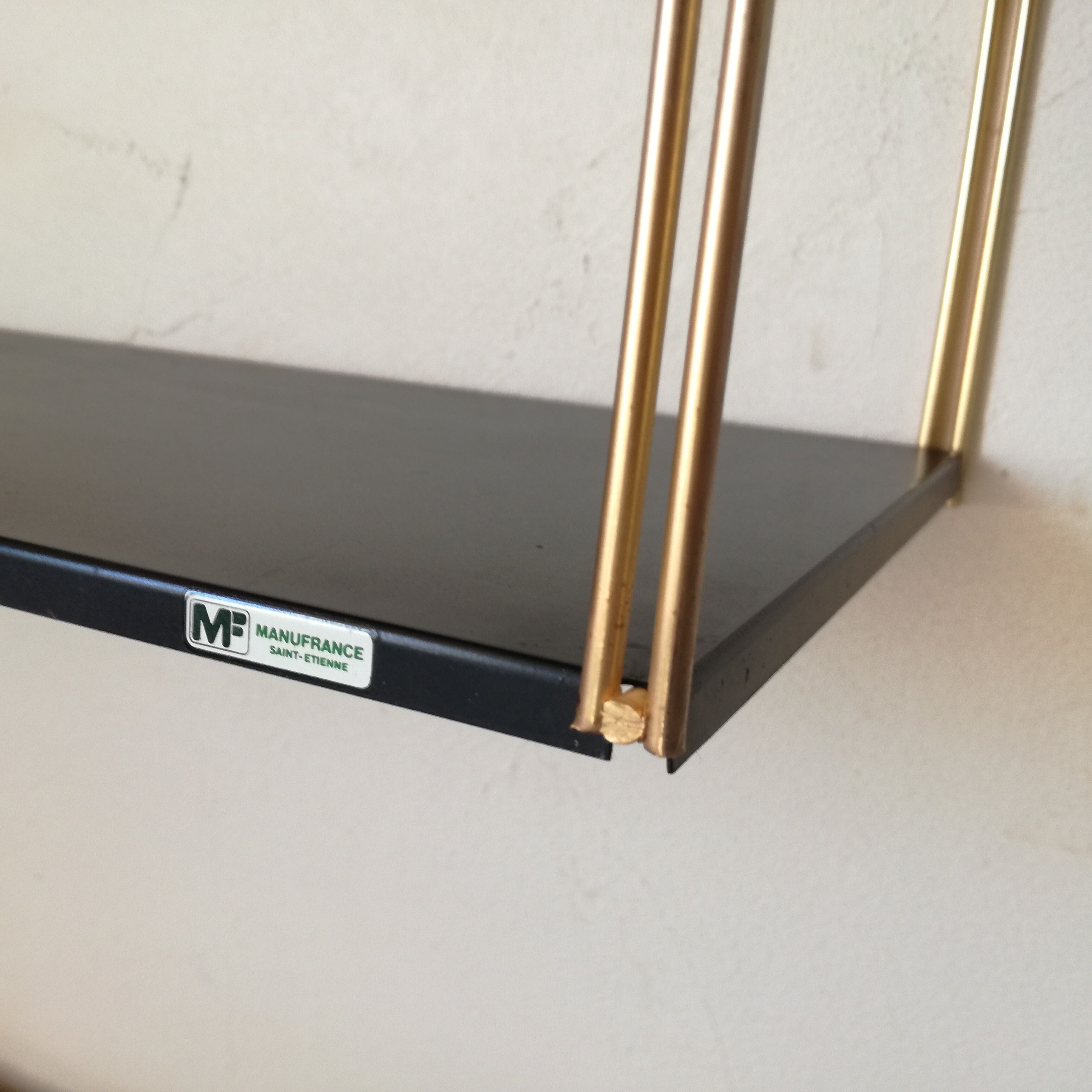 Gold and black thong shelf