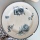 Old dish of opaque porcelain on ground transfer service