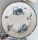 Old dish of opaque porcelain on ground transfer service