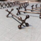 17 Christofle silver-plated knife rests in the Atonium model.