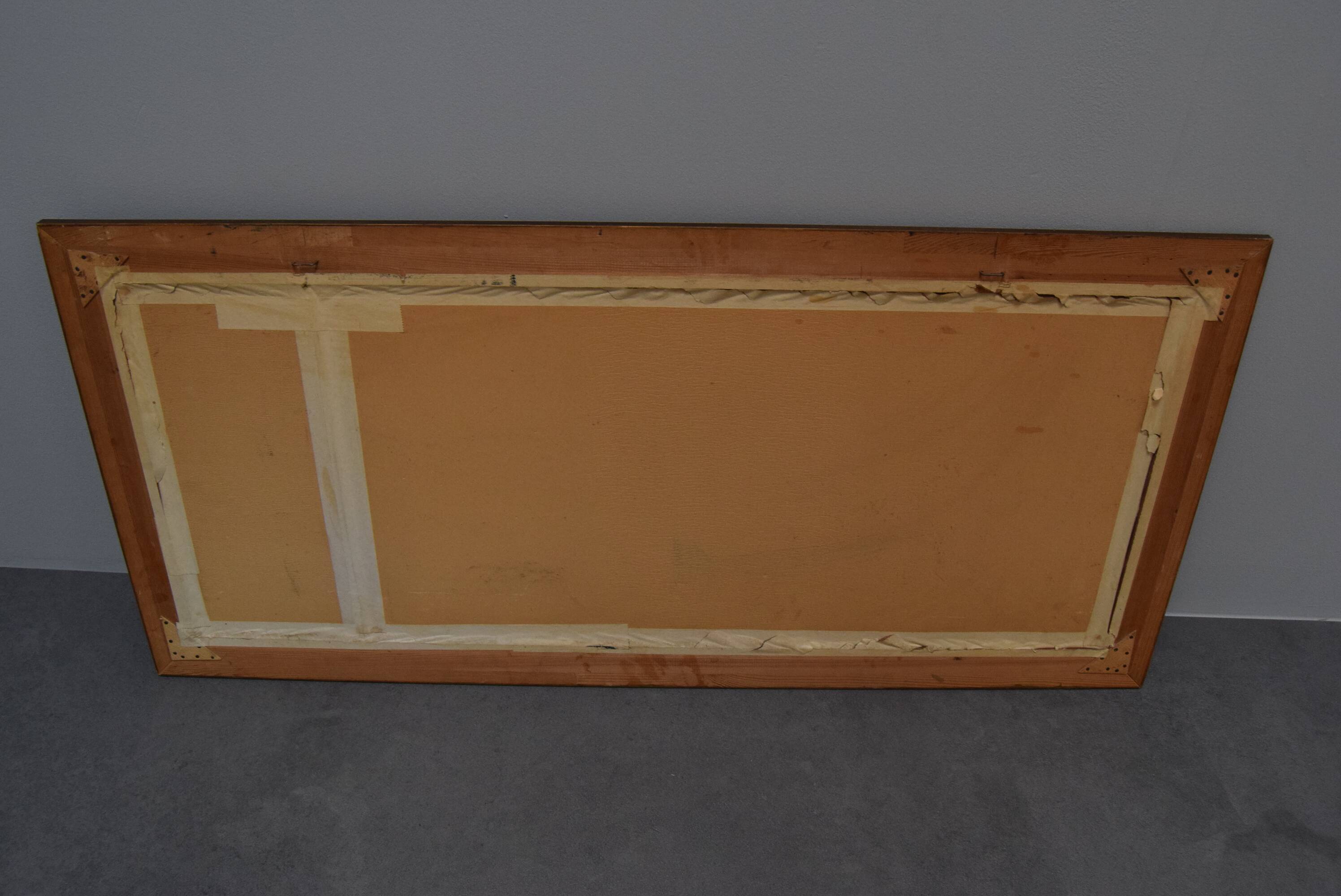 wall mirror in a decorative wooden frame.